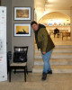 Дивото 2023 - изложбата. Евтим Бачев, позира пред негов кадър отличен с FIAP почетна лента.
